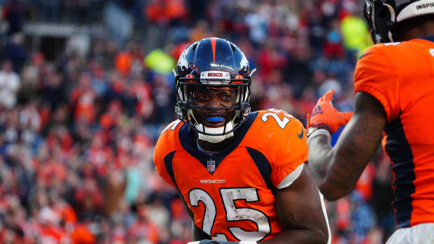 Denver Broncos running back Melvin Gordon III (25) reacts following his touchdown carry in the third quarter against the Detroit Lions at Empower Field at Mile High.